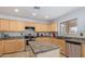 Modern kitchen featuring stainless steel appliances, ample counter space, and a stylish backsplash at 1805 E Aloe Pl, Chandler, AZ 85286