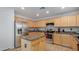 Well-equipped kitchen with stainless steel appliances, a center island, and ample cabinet space at 1805 E Aloe Pl, Chandler, AZ 85286