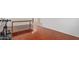 Bright living room with wood tile flooring and white walls at 1805 E Aloe Pl, Chandler, AZ 85286