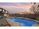 Private backyard featuring a sparkling pool, ample patio space, and mature landscaping at 1805 E Aloe Pl, Chandler, AZ 85286