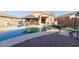 Backyard with a pool, gazebo, hot tub, barbecue, and sun loungers at 18842 N Lariat Rd, Maricopa, AZ 85138