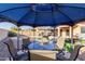 View from inside a gazebo to a private backyard with pool and chairs at 18842 N Lariat Rd, Maricopa, AZ 85138