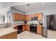 Efficient kitchen featuring stainless steel appliances, ample cabinet space, and a breakfast bar at 18842 N Lariat Rd, Maricopa, AZ 85138