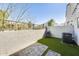 Private backyard featuring artificial turf, a brick patio, and a view of the neighborhood at 2228 W Harmont Dr, Phoenix, AZ 85021