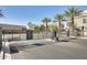 Community entrance gate with decorative wrought iron and stone pillars, providing security and curb appeal at 2228 W Harmont Dr, Phoenix, AZ 85021