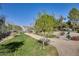 Beautifully landscaped community park with grassy areas, walking paths, and mature trees, perfect for outdoor activities at 2228 W Harmont Dr, Phoenix, AZ 85021