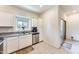 Bright kitchen with stainless steel appliances, white cabinets, and granite countertops at 2228 W Harmont Dr, Phoenix, AZ 85021