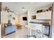 Living room featuring a kitchenette, with sleek cabinets and stylish decor at 2228 W Harmont Dr, Phoenix, AZ 85021