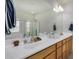 Bathroom featuring a double sink vanity and a walk in shower at 2373 N Riverside Dr, Florence, AZ 85132