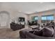 Spacious living room featuring neutral colors and a beautiful view from the windows at 2373 N Riverside Dr, Florence, AZ 85132