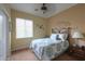 Cozy bedroom with a decorative bed, a bright window, and carpeted floors at 2509 E Dulcinea Trl, Casa Grande, AZ 85194