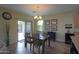 The dining room is connected to the kitchen and features a sliding glass door to the outdoor space at 2509 E Dulcinea Trl, Casa Grande, AZ 85194