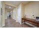 Wide hallway features neutral paint, tile floor, with plenty of space to move around at 2509 E Dulcinea Trl, Casa Grande, AZ 85194