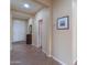 Welcoming hallway features tile flooring, a front door, and tasteful decorations at 2509 E Dulcinea Trl, Casa Grande, AZ 85194