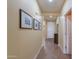 Inviting hallway with neutral tones, beautiful tile floors, and decorative wall art at 2509 E Dulcinea Trl, Casa Grande, AZ 85194