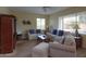 Comfortable living room with neutral walls, sofas and a ceiling fan at 2509 E Dulcinea Trl, Casa Grande, AZ 85194