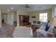 Bright open-plan living room with carpet and tile flooring at 2509 E Dulcinea Trl, Casa Grande, AZ 85194