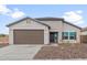 Charming single-story home featuring a two-car garage and a well-manicured front yard at 2638 N Coronado Dr, Florence, AZ 85132