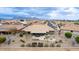 Scenic aerial view of the home's backyard, showcasing the covered patio, landscaping, and mountain views at 2712 S Tambor --, Mesa, AZ 85209