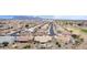 Expansive aerial view of the neighborhood featuring well-maintained homes, desert landscaping, and mountain views at 2712 S Tambor --, Mesa, AZ 85209