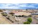 Scenic aerial view of the home's outdoor spaces featuring desert landscaping, covered patio, and comfortable seating areas at 2712 S Tambor --, Mesa, AZ 85209