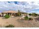 Landscaped backyard with desert landscaping, a covered patio, and built-in barbecue at 2712 S Tambor --, Mesa, AZ 85209