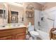 Bathroom featuring a single sink vanity, white tub and shower combo and rustic shelving at 2712 S Tambor --, Mesa, AZ 85209