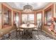 Charming dining area featuring an elegant chandelier and windows with plantation shutters at 2712 S Tambor --, Mesa, AZ 85209