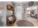 Inviting foyer with a bench, coat rack, and view into the spacious living area at 2712 S Tambor --, Mesa, AZ 85209