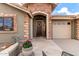 Welcoming front entryway with stone accents and a decorative front door at 2712 S Tambor --, Mesa, AZ 85209