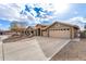 Well-maintained home featuring a three-car garage and xeriscaped front yard at 2712 S Tambor --, Mesa, AZ 85209