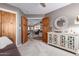 Living Room with view through wood doors and featuring a white media cabinet at 2712 S Tambor --, Mesa, AZ 85209