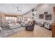 Spacious living room featuring comfortable seating, a ceiling fan, and a relaxing atmosphere at 2712 S Tambor --, Mesa, AZ 85209