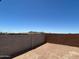 Fenced backyard area, offering clear view of the distant mountains and a sense of privacy at 27288 N 74Th Ln, Peoria, AZ 85383
