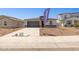 Charming single-story home with a two-car garage, stone accents, and low maintenance desert landscaping at 27288 N 74Th Ln, Peoria, AZ 85383