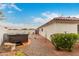 A hot tub sits just outside the home and a garden in this back yard area at 28617 N 50Th Pl, Cave Creek, AZ 85331