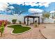 Beautiful backyard featuring a gazebo, artificial turf, and desert landscaping at 28617 N 50Th Pl, Cave Creek, AZ 85331