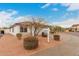 Charming single-story home with a tile roof, neutral stucco, and a two-car garage, set against a partly cloudy sky at 28617 N 50Th Pl, Cave Creek, AZ 85331