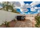 This backyard includes a hot tub with a small patio area at 28617 N 50Th Pl, Cave Creek, AZ 85331