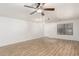 Bright living room with wood floors, ceiling fan, and natural light at 28617 N 50Th Pl, Cave Creek, AZ 85331