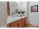 Bathroom featuring a single sink and wood cabinets at 31446 N Candlewood Dr, San Tan Valley, AZ 85143