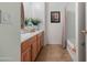 Bathroom with a single sink, wood cabinets, and bathtub with shower at 31446 N Candlewood Dr, San Tan Valley, AZ 85143