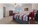 Bedroom featuring a ceiling fan, and a large wooden dresser at 31446 N Candlewood Dr, San Tan Valley, AZ 85143