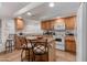 Well-lit kitchen featuring a center island with bar stools, ample cabinet space, and modern appliances at 31446 N Candlewood Dr, San Tan Valley, AZ 85143