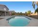 A sparkling backyard pool with a covered patio and mature landscaping at 31446 N Candlewood Dr, San Tan Valley, AZ 85143