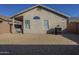 Low-maintenance backyard featuring gravel landscaping, a covered patio, and privacy walls at 3313 E Waltann Ln, Phoenix, AZ 85032