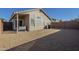 Low-maintenance backyard featuring gravel landscaping, a covered patio, and privacy walls at 3313 E Waltann Ln, Phoenix, AZ 85032