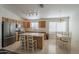 Eat-in kitchen featuring stainless steel appliances, wood cabinets, and an island with barstool seating at 3313 E Waltann Ln, Phoenix, AZ 85032