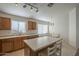 Bright kitchen with island and breakfast bar, seamlessly connected to the dining area at 3313 E Waltann Ln, Phoenix, AZ 85032