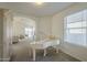 The living room features neutral paint, plush seating, and view into a second living space with a white piano at 3313 E Waltann Ln, Phoenix, AZ 85032